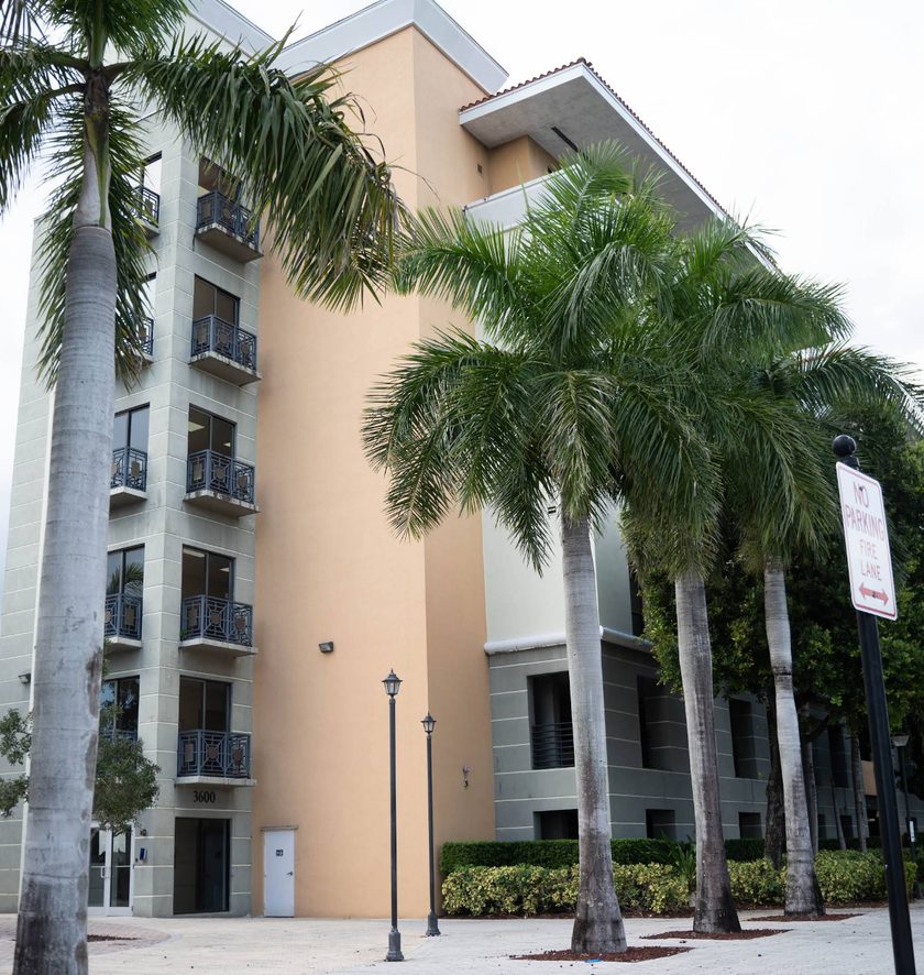 Exterior of the Florida Helps rehab treatment center in Miramar with palm trees