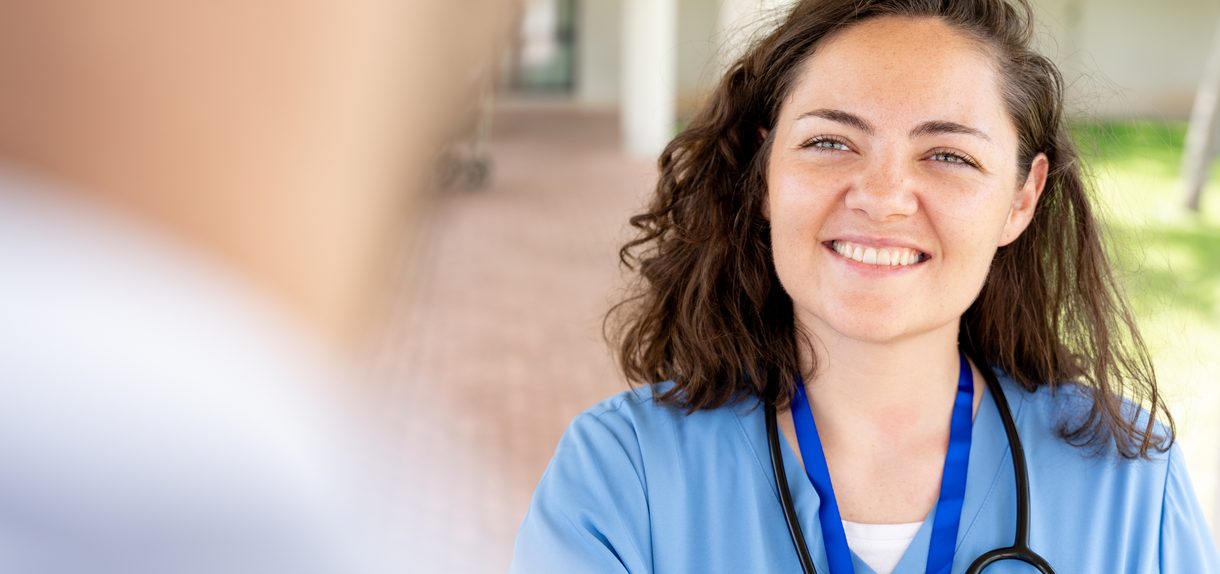 Nurse smiling during a medical detox consultation at Florida Helps